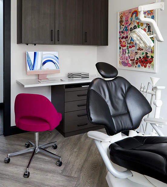 Dentist and dental assistant reviewing patient x-rays from clientex:PracticeName